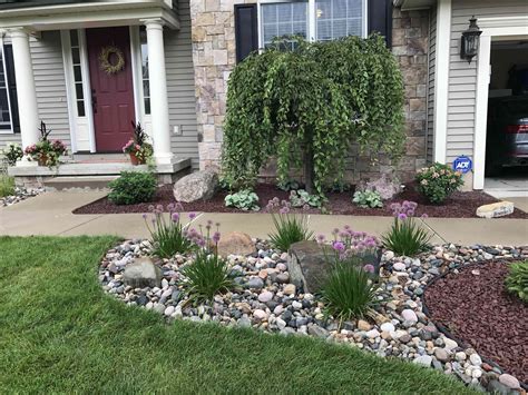 Rock yard - Here are 12 front yard landscaping ideas with rocks and interesting plantings. 1. Paving Stones, Pebbles And Planter Boxes. For a low maintenance front yard with just a pop of color, you can’t go past the clean and simple lines of this design. Large paving stones are laid to provide a path to the front door. 
